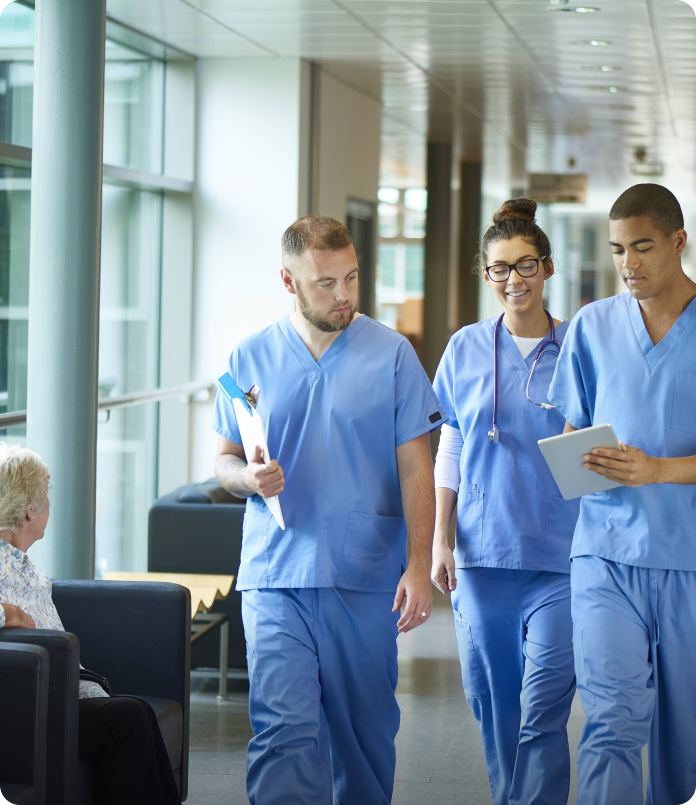 Medical professionals in hospital corridor